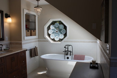 Mid-sized elegant master white tile and subway tile marble floor and white floor freestanding bathtub photo in Seattle with shaker cabinets, dark wood cabinets, beige walls, an undermount sink and marble countertops