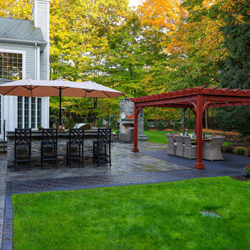 Make a Statement with a Versatile Outdoor Kitchen and Double Fire Feature