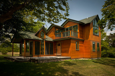 Example of a trendy two-story wood exterior home design in Providence