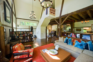 Huge country open concept dark wood floor and brown floor living room photo in Boston with white walls, a wood stove, a plaster fireplace and no tv