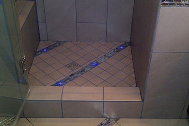 Inspiration for a mid-sized timeless master gray tile and porcelain tile porcelain tile alcove shower remodel in Los Angeles