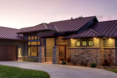 Mid-sized craftsman gray one-story mixed siding exterior home idea in Other with a metal roof