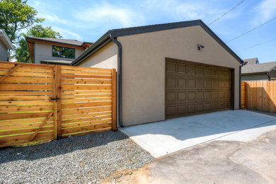 Example of a large minimalist detached two-car garage design in Denver
