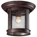 Z-Lite - Bronze 1 Light Outdoor Flushmount Ceiling Fixture with Clear Seedy Shade - This cast aluminum outdoor flush mount uses seedy clear glass to create a unique look along with the weathered bronze finish.