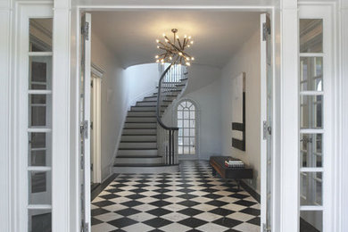 Inspiration for a mid-sized contemporary front door in New York with white walls, marble floors, a double front door, a white front door and multi-coloured floor.