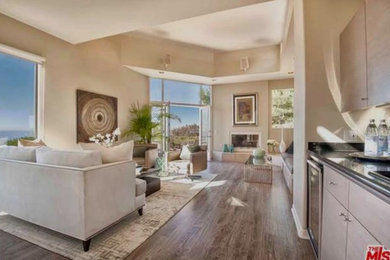 Inspiration for a transitional formal light wood floor living room remodel in Los Angeles with white walls, a standard fireplace and no tv