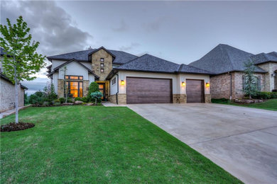 Example of a transitional two-story exterior home design in Oklahoma City