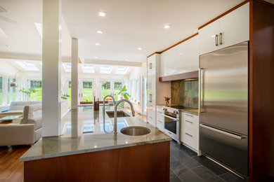 Photo of a modern kitchen in New York with with island.