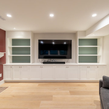 Finished Basement Living Room with Custom Media Wall and Brick Fireplace