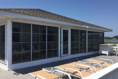 Example of a sunroom design in Other