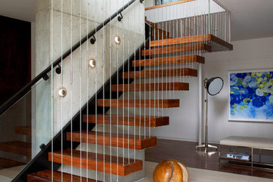 Inspiration for a modern wood floating staircase in New York.