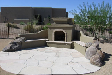 Mid-sized southwest backyard patio photo in Phoenix with a fire pit