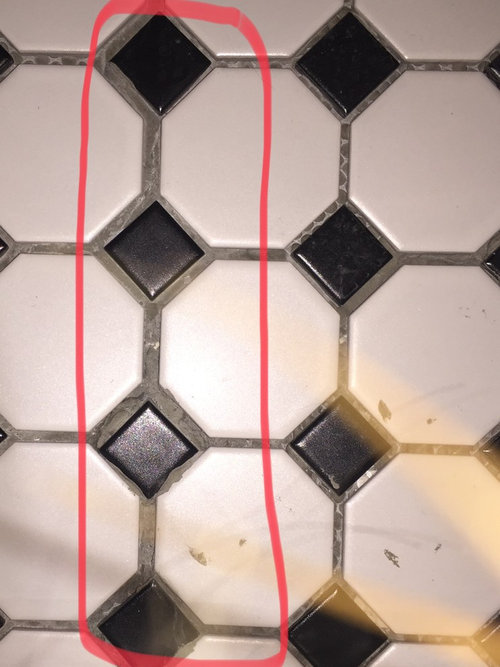 Help! Is this a bad tile job or am I crazy?