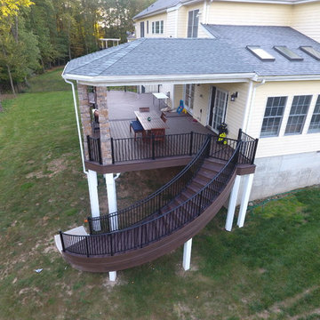 State of the Art Trex Deck, Curved Stairs, Hip-Roof