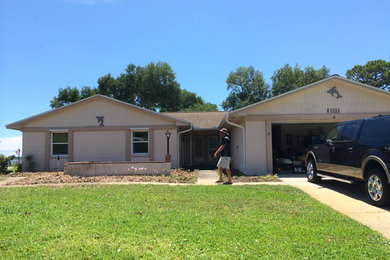 Example of a beach style home design design in Jacksonville