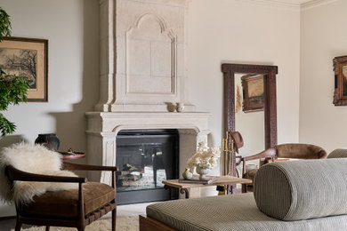 Living room - mid-sized transitional enclosed dark wood floor and brown floor living room idea in Dallas with beige walls, a standard fireplace and a plaster fireplace