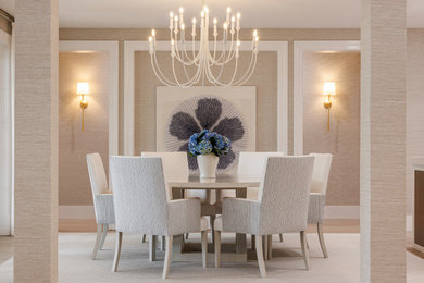 Example of a beach style light wood floor, beige floor, wall paneling and wallpaper kitchen/dining room combo design in Miami with beige walls