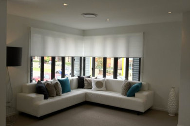 Inspiration for a contemporary living room in Sydney with carpet.