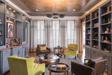 Example of a mid-sized eclectic medium tone wood floor and brown floor wet bar design in Dallas with an undermount sink, shaker cabinets, gray cabinets and wood countertops