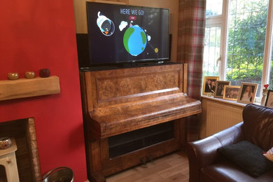 Bespoke made tv cabinet. Made from a reclaimed piano. Using a mechanic or remote