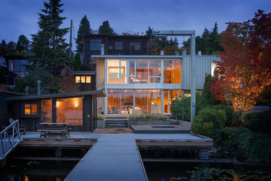 Modern two-storey grey exterior in Seattle with metal siding and a gable roof.