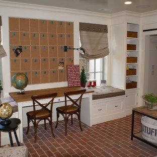 Inspiration for a traditional home office in Atlanta with brick floors.