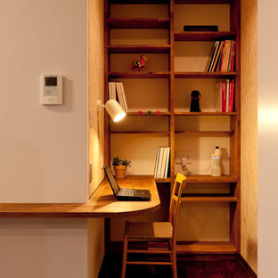 Photo of a modern home office and library in Other.
