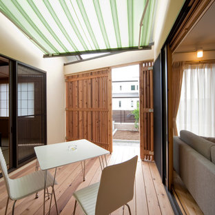 他の地域のアジアンスタイルのおしゃれなデッキ (オーニング・日よけ) の写真