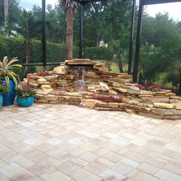 After- Finished custom pond-less waterfall with plantings