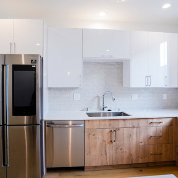 Stainless Steel Furnishings and White Cabinetry