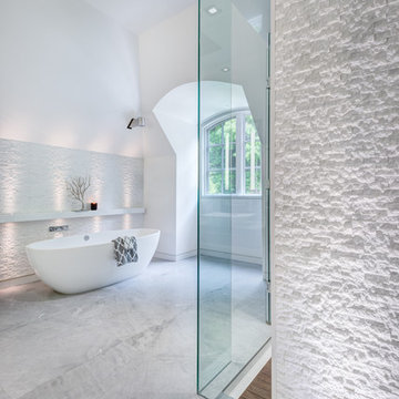 Views of this beautiful stand alone soaker tub in this modern bathroom