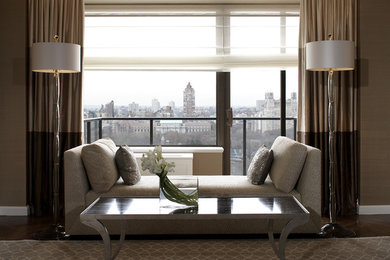 Inspiration for a mid-sized modern formal and open concept medium tone wood floor and brown floor living room remodel in New York with brown walls, no fireplace and no tv