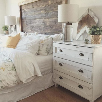 Farmhouse Country Style Bedroom with white bed sheets, white bed skirt
