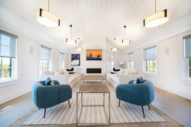 Example of a beach style family room design in Boston