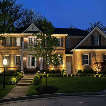 Uplighting and path lighting on house front