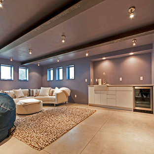 This is an example of a contemporary basement in Salt Lake City with purple walls and concrete flooring.