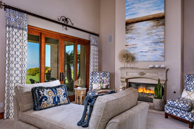 Living room - mid-sized mediterranean formal and open concept carpeted and beige floor living room idea in Wilmington with beige walls, a standard fireplace, a stone fireplace and no tv
