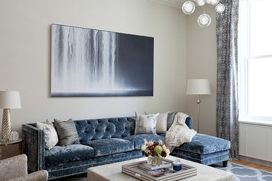 Inspiration for a large transitional loft-style light wood floor living room remodel in New York with beige walls, no fireplace and a wall-mounted tv