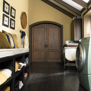 Inspiration for a medium sized traditional galley utility room in Chicago with recessed-panel cabinets, dark wood cabinets, yellow walls and cork flooring.