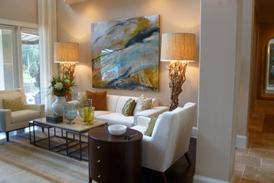 Example of a mid-sized island style formal and enclosed travertine floor living room design in Jacksonville with beige walls, no fireplace and no tv