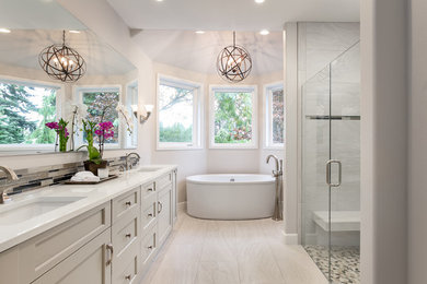 Example of a transitional gray tile bathroom design in Seattle with gray cabinets, gray walls, an undermount sink and a hinged shower door