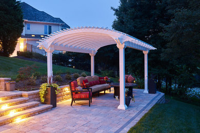 Patio - backyard concrete paver patio idea in DC Metro with a pergola