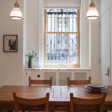 Custom Cabinetry and Marble Countertop Create Usable Space Around Radiator