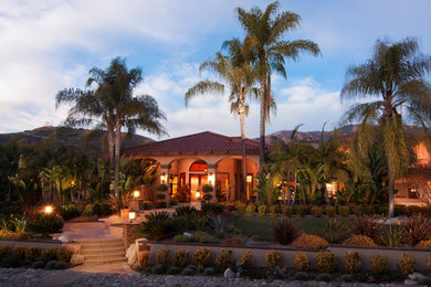 Inspiration for a tropical exterior home remodel in Los Angeles