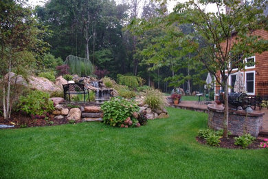 Inspiration for a traditional garden in New York with a garden path and natural stone pavers.
