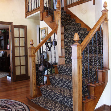 Elm Grove beautiful entryway staircase with wrought iron balusters