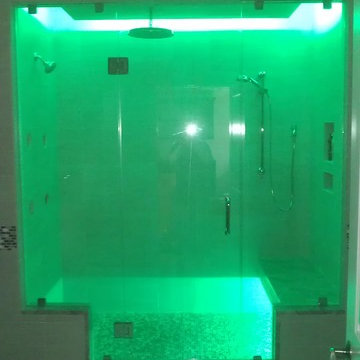 Frameless Glass Shower with Bench Seat and Custom Lighting