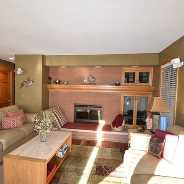 Before view family room fireplace and lower level stair with door.