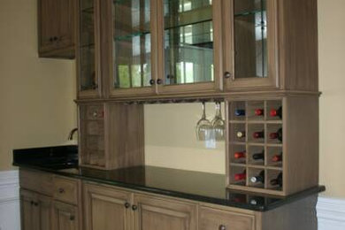 Home bar - traditional home bar idea in Charlotte