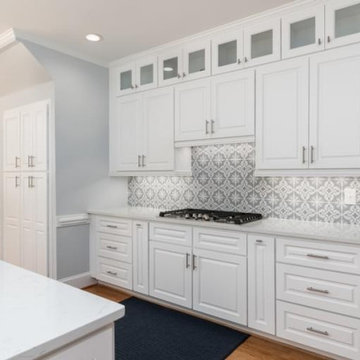 Sleek Modern Kitchen Remodel with White Cabinets & Grey Mosaic Backsplash